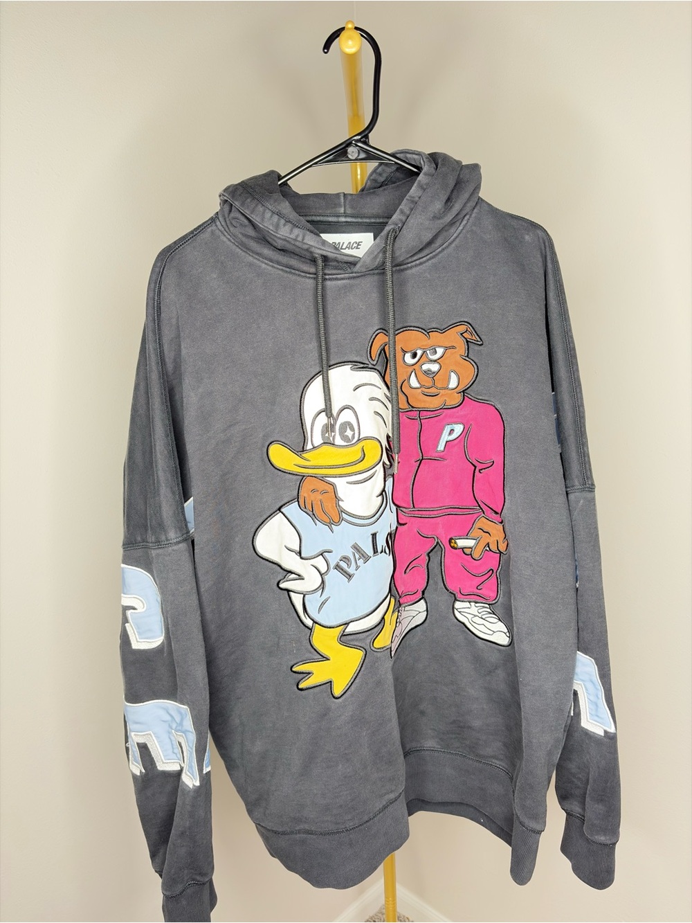 PALACE Charcoal Hoodie with Pink & Yellow Cartoon Graphic
